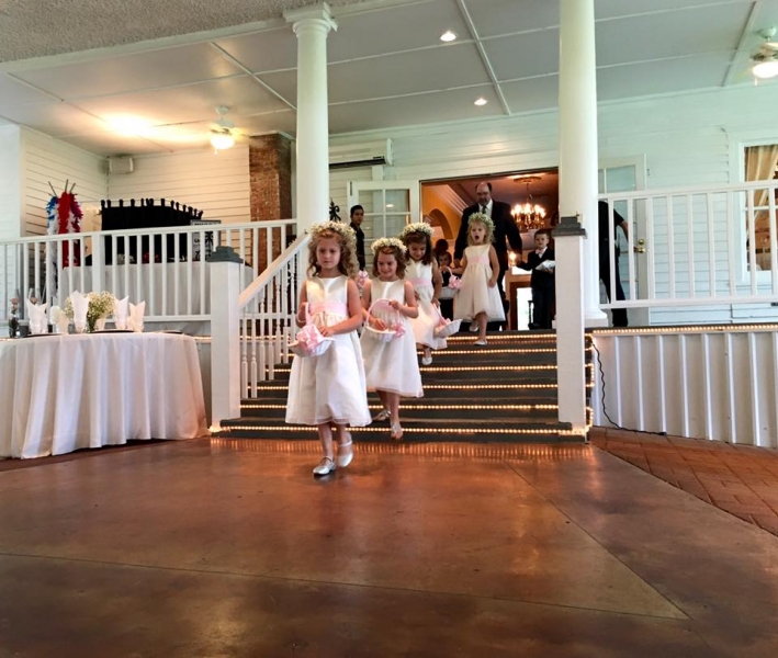 Adorable flower girl train at an indoor wedding at House Estate