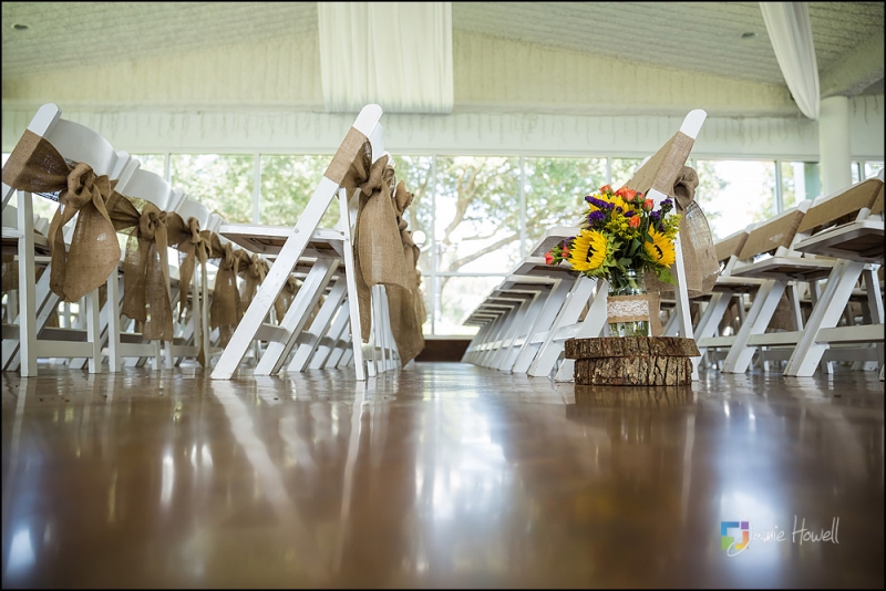 Rustic aisle markers at an indoor wedding at House Estate