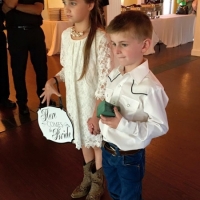 Flower girl in cowboy boots and a ring bearer at House  Estate