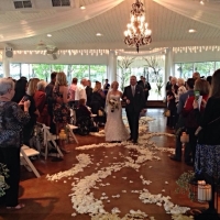 bride and groom at House  Estate and rose petals.JPG