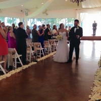 july indoor wedding walking the aisle with white rose petals
