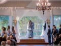 Loving embrace at an indoor wedding at House  Estate