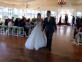 Walking the aisle with white rose petals and green sashed chairs at House  Estate