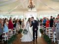 Wedding-couple-sharing-a-kiss-after-saying-I-dos-at-House-Estate-min