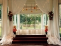 indoor wedding altar with flowers
