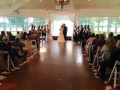 vows in August with aisle lined with feathers