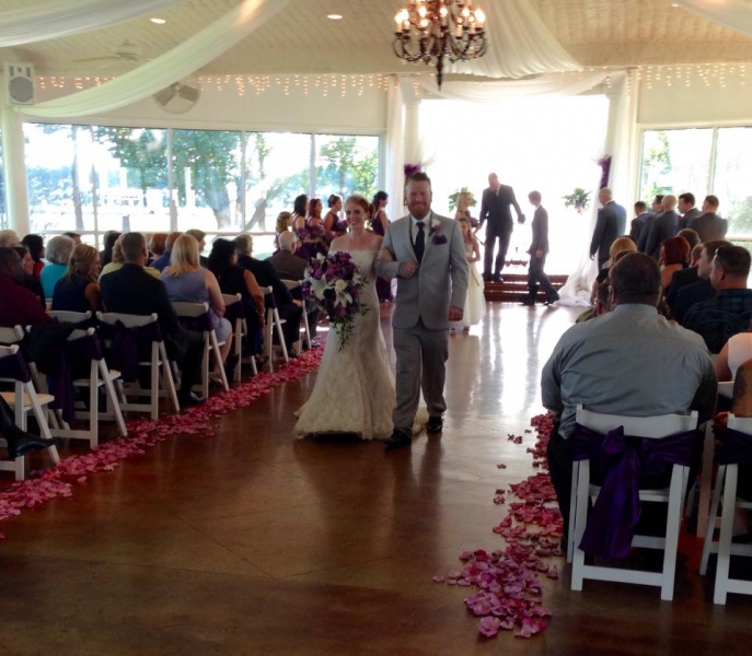 walking the aisle and soft pink rose petals