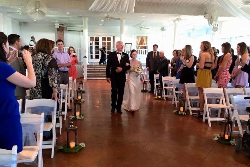 walking the aisle in oct aligned with elegant lanterns