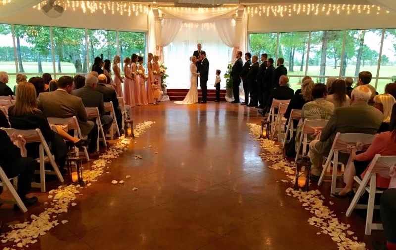 wedding in November with aisle with rose petals and lanterns