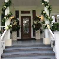 Entrance with flowers galore at House Estate