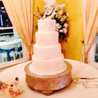 beautiful and sleek wedding cake with beading.jpg