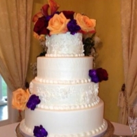 wedding cake with bright and vivid flowers