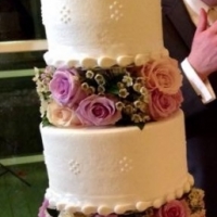 wedding cake with roses and bride and groom.JPG