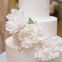 wedding cake with white flowers pic by Eric & Jenn Photography