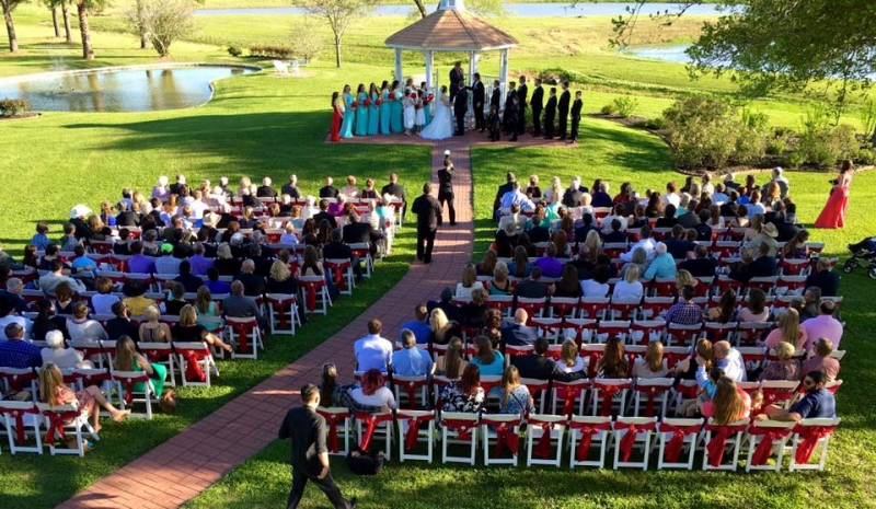 Outdoor wedding overlooking the lakes and ponds at House  Estate