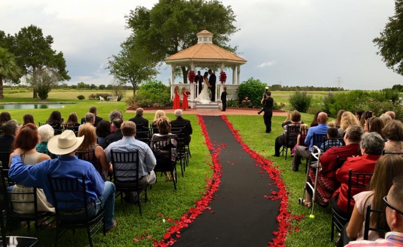 breathtaking outdoor wedding with red rose petals at House  Estate