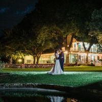 Wedding couple embrace for outdoor ceremony