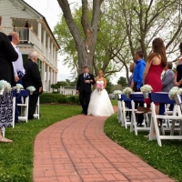 Father walking the bride at an outdoor wedding with trees galore at House  Estate