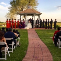 Red and black decor at an outdoor wedding at House  Estate