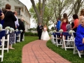 Father walking the bride at an outdoor wedding with trees galore at House  Estate