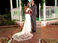 outdoor wedding with a lit up gazebo at night in december