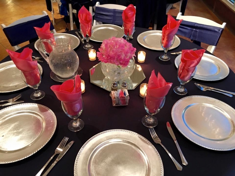 Elegantly dressed tables with candles at a reception at House Estate