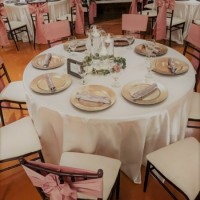 Cylinder-candle-centerpieces-with-ivory-tablecloths-at-House-Estate