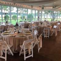 Houston-reception-tables-sprinkled-with-centerpiece-lanterns-flowers-and-candles