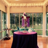 bride and groom table with decor and outdoor views