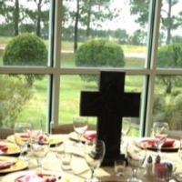 reception table with cross centerpiece