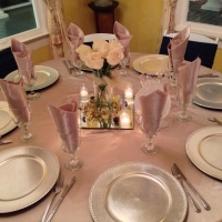 reception table with roses, mirrors and candles