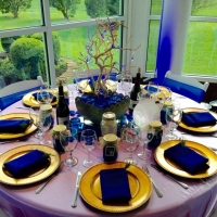 reception tables with vibrant blue decor.jpg