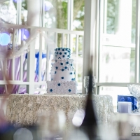 reception tables with wedding cake in Houston