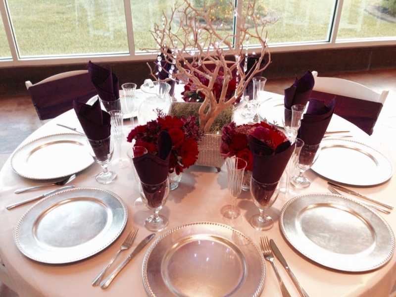 reception table with pastel colors and silver chargers