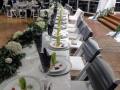 Beautifully set tables with flowers and tasty appetizers