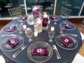 reception tables with water filled flower centerpieces