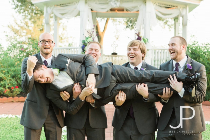 Groom and grooms men in Sept having some fun at a Houston venue