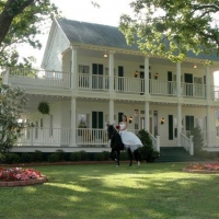 beautiful victorian mansion with horse and bride