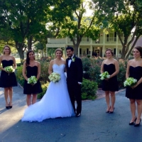 bridesmaids and wedding couple in front of House Estate