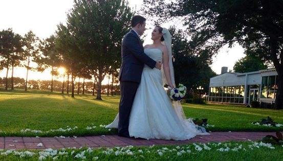 september outdoor wedding aligned with white rose petals