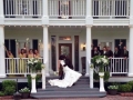 a dip at the front steps with the wedding party and bride and groom.JPG