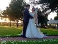 september outdoor wedding aligned with white rose petals