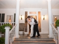 wedding kiss pics at front of mansion by Eric & Jenn Photography