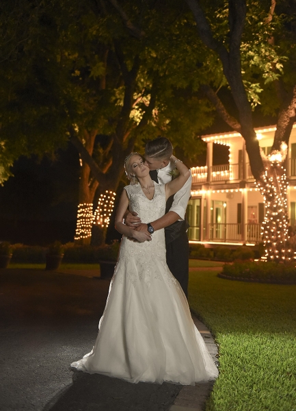 wedding kiss in front of House Estate