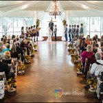 taking vows at indoor wedding with breathtaking outdoor venues at a Houston facility