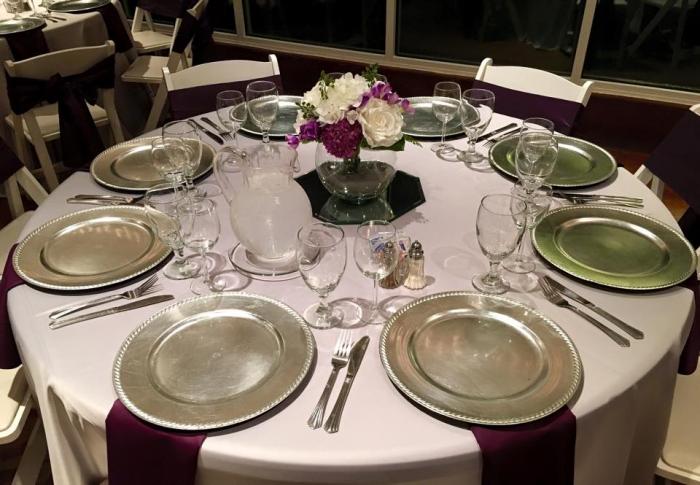 Reception table at House Plantation with silver chargers